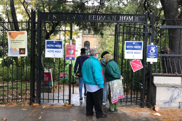 Senior citizens line up outside the Andrew Freedman Home in the Bronx